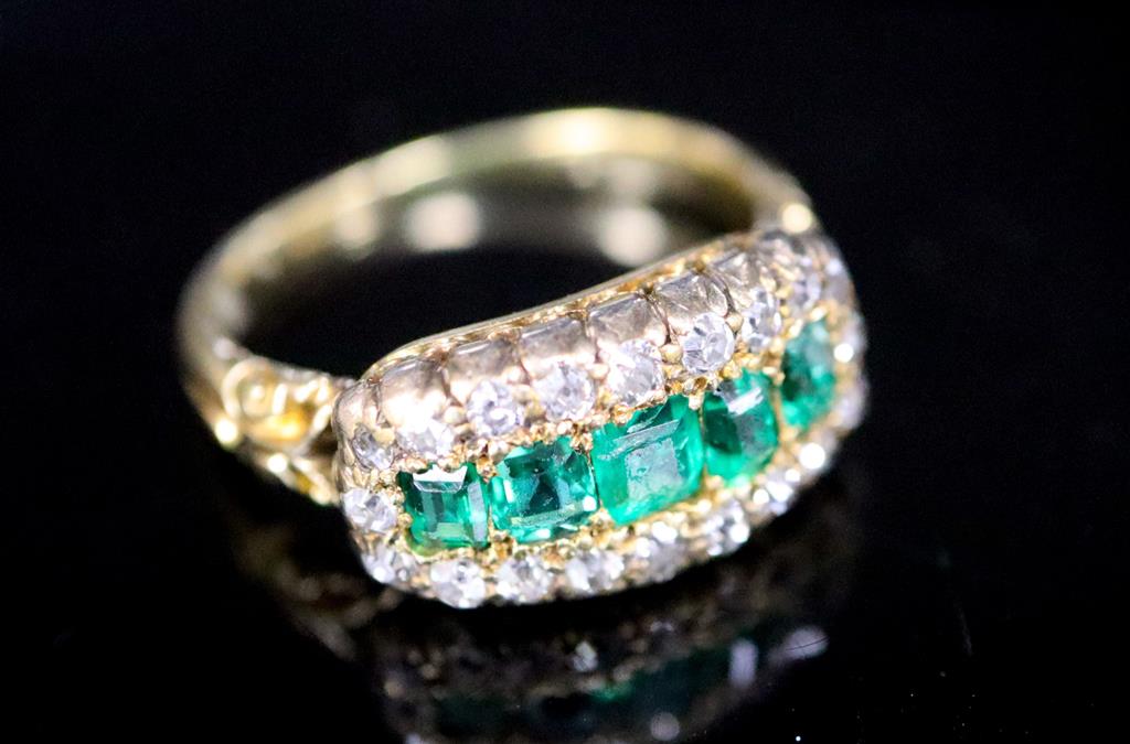 A late Victorian gold, graduated five stone emerald and diamond cluster half hoop ring,